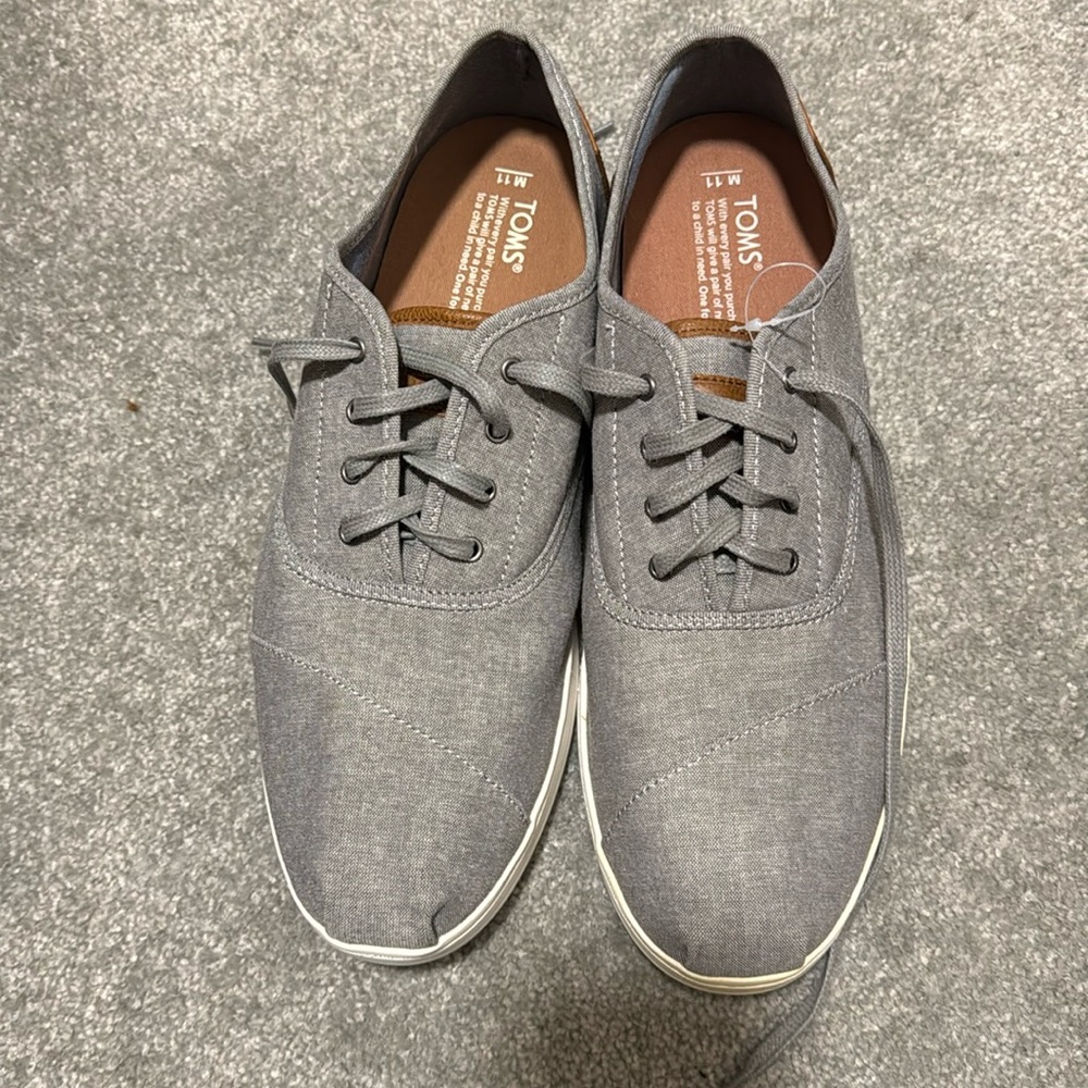 Men’s size 11 toms.  Grey.  Brand new.  Never worn